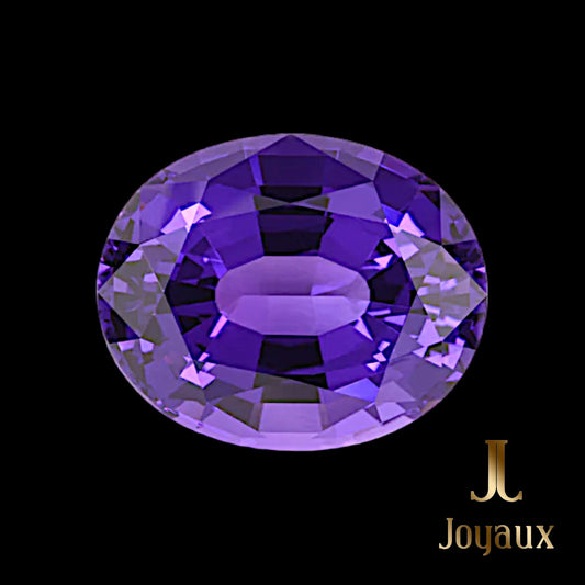 In the heart of Brazil, beneath the lush canopies and amidst the whispering winds of ancient forests, lies the legendary Minas Gerais, a land rich with the finest amethysts ever discovered. The 111.77-Carat Amethyst from Joyaux™ Genève is a marvel of this storied region, capturing the essence of its mystical origins. With dimensions of 35.00 x 28.50 x 20.30 mm, this oval-cut gem radiates a deep, entrancing purple, reminiscent of twilight skies over the Amazon