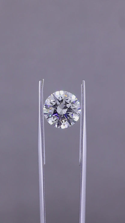 This 5.02 carat Round Brilliant diamond, crafted to the pinnacle of perfection, embodies the very essence of opulence and sophistication